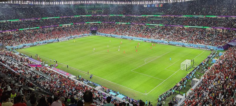 Full stands and floodlit pitch at Education City Stadium during the 2022 World Cup match between Portugal and South Korea