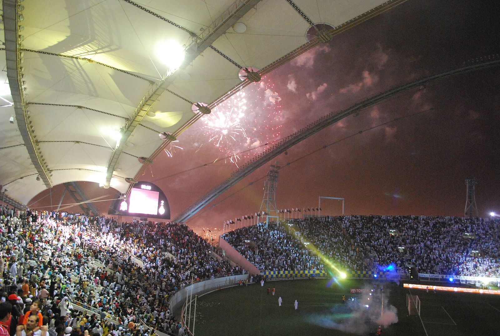 Floodlit Khalifa International Stadium during the 2009 Amir Cup final, with fireworks above the roof, years before its 2017 redevelopment