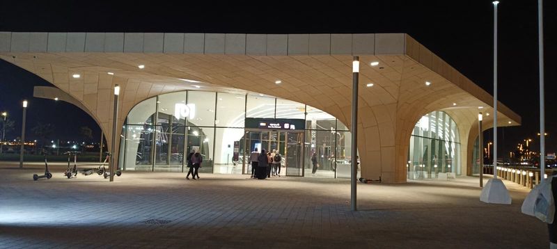 Entrance of Ras Bu Abboud station on the Doha Metro Gold Line at night, the station serving the Stadium 974 site